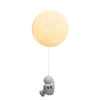 Astronaut Climbing Moon Wall Lamp for space-themed decor3